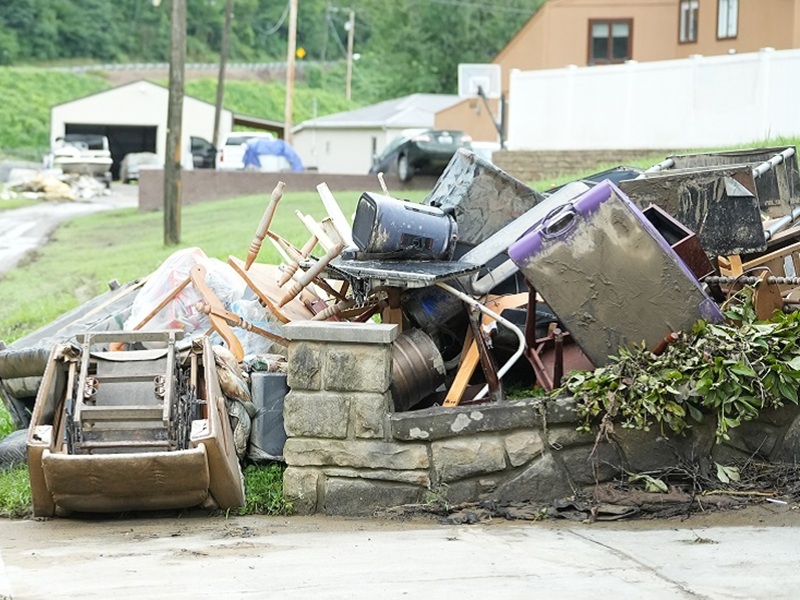 Image of furniture and other household items ruined by flood water